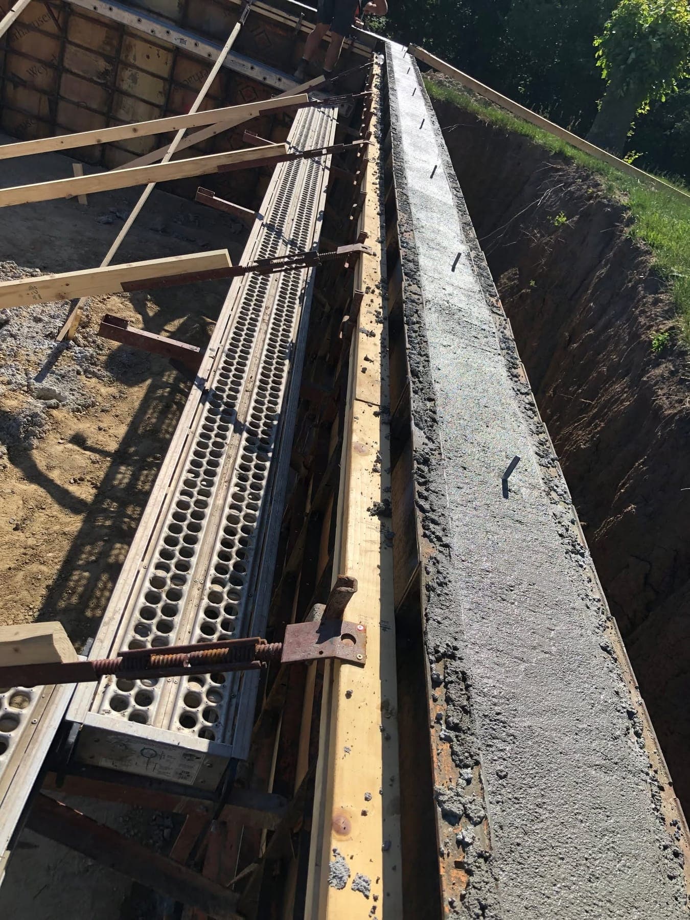 A poured foundation wall still in its forms